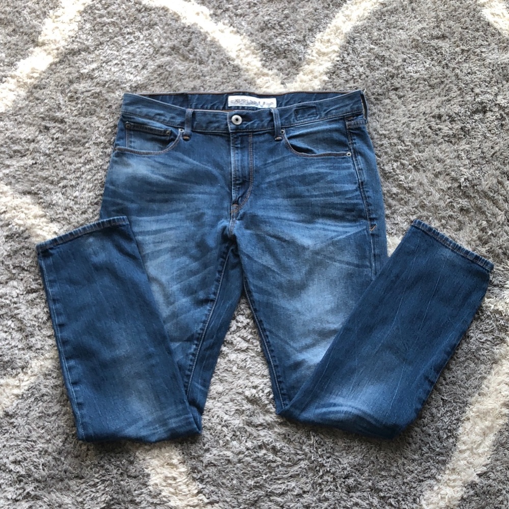 Express men’s skinny fit jeans. Light wash